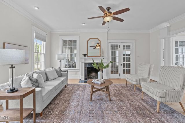 a living room with furniture and a rug