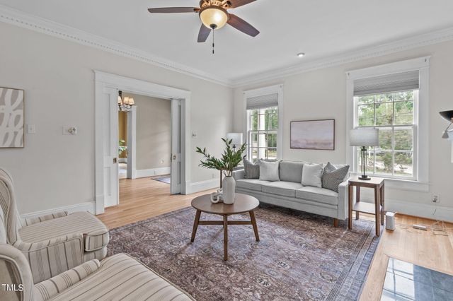 a spacious bedroom with a bed and a large window