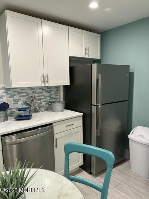 65 Mt Hermon Way, Unit 4 Ocean Grove, NJ 07756 - Photo 4 of 10 a kitchen with a refrigerator sink and stove