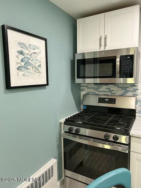 65 Mt Hermon Way, Unit 4 Ocean Grove, NJ 07756 - Photo 6 of 10 a kitchen with stainless steel appliances granite countertop a stove and a microwave