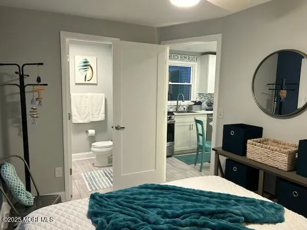 a bedroom with a bed and a mirror