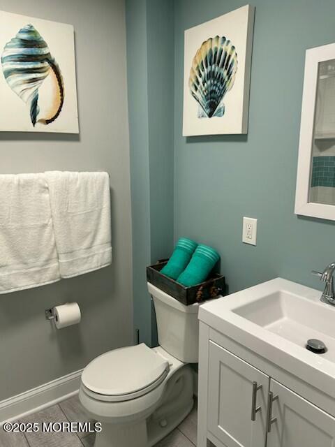 65 Mt Hermon Way, Unit 4 Ocean Grove, NJ 07756 - Photo 10 of 10 a bathroom with a toilet a sink and mirror
