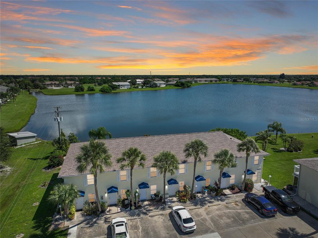 an aerial view of a house with a lake view