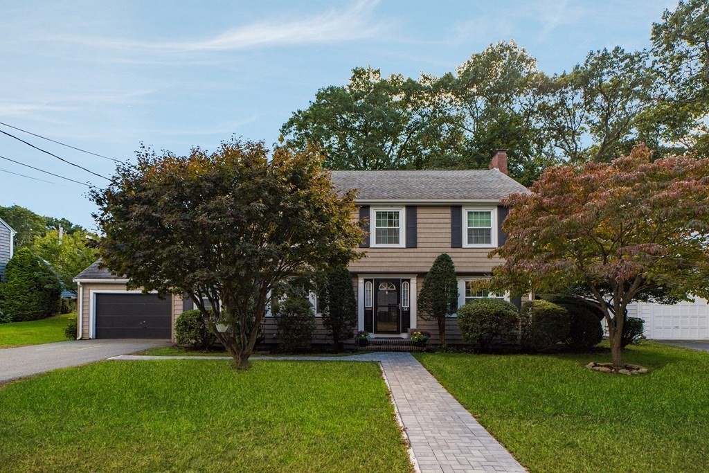 14 Gordon Road Milton, MA 02186 - Photo 1 of 38 a front view of a house with a garden
