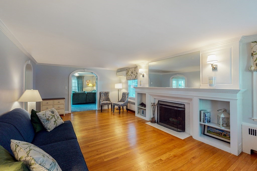 14 Gordon Road Milton, MA 02186 - Photo 13 of 38 a living room with furniture and a fireplace