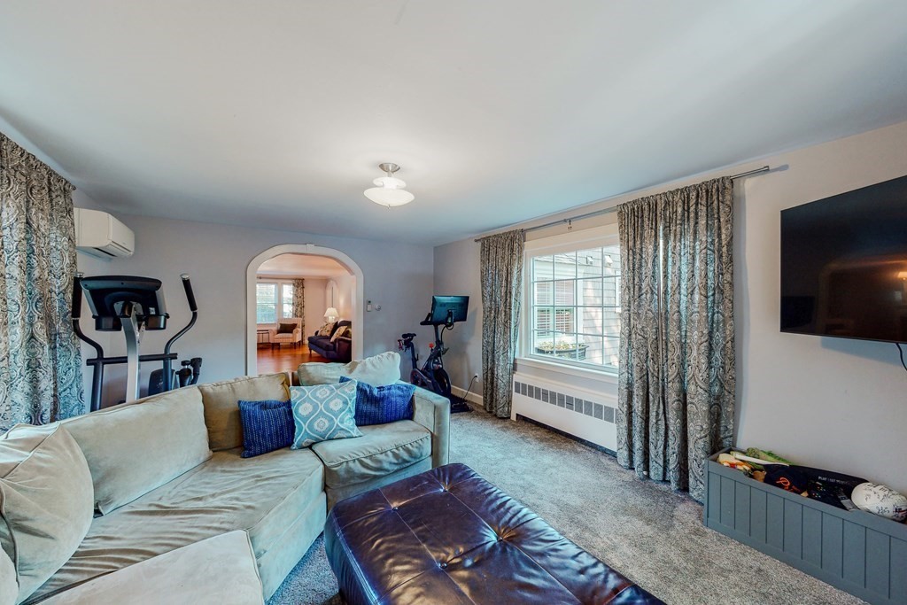 14 Gordon Road Milton, MA 02186 - Photo 16 of 38 a living room with furniture and a flat screen tv