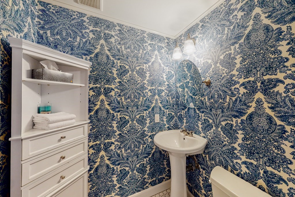 14 Gordon Road Milton, MA 02186 - Photo 17 of 38 a bathroom with a sink and a mirror