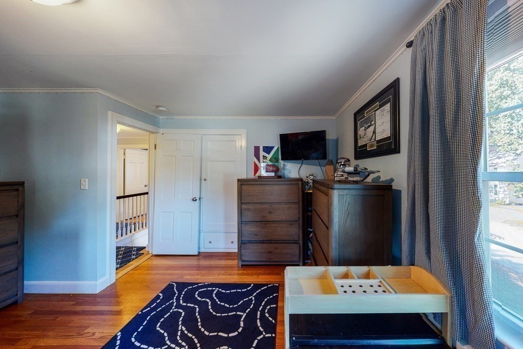 14 Gordon Road Milton, MA 02186 - Photo 24 of 38 a bedroom with a bed and a television