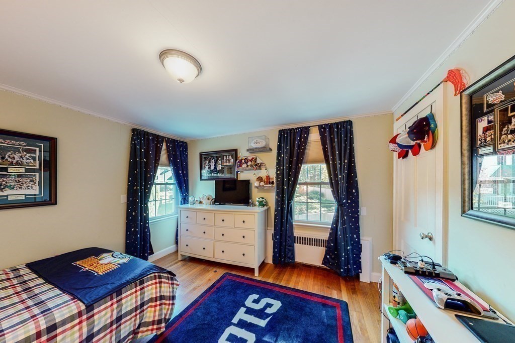 14 Gordon Road Milton, MA 02186 - Photo 25 of 38 a bedroom with furniture and a window