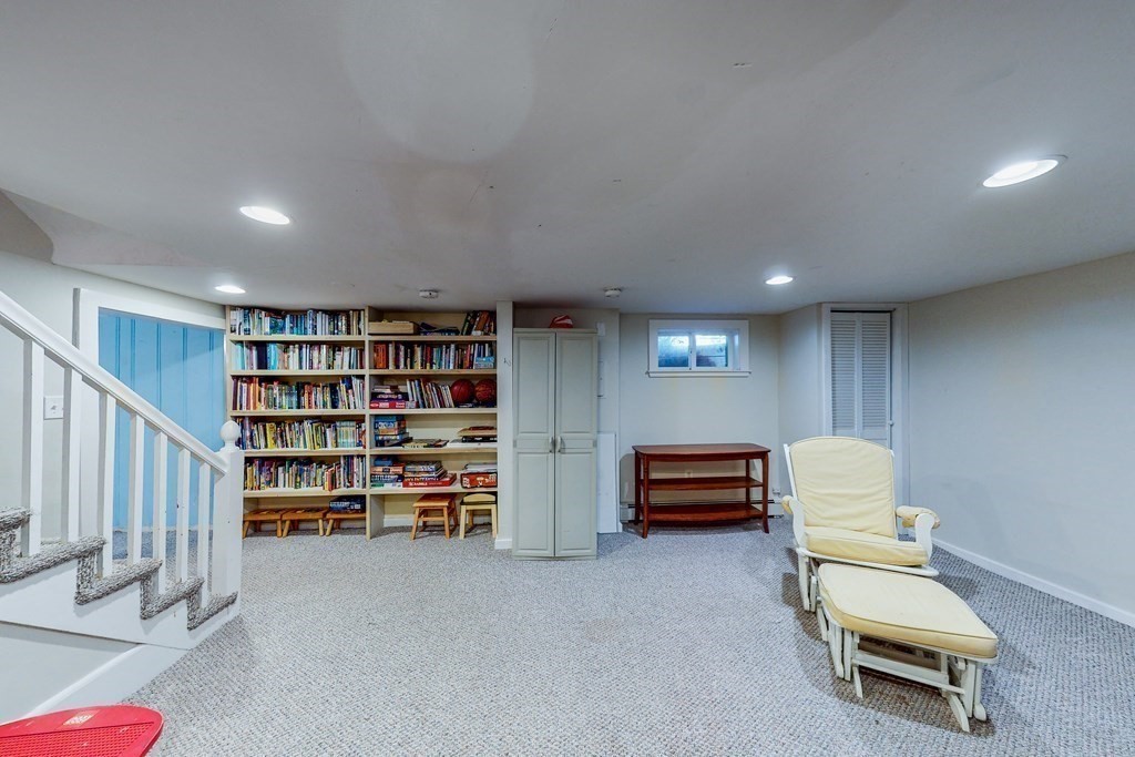 14 Gordon Road Milton, MA 02186 - Photo 29 of 38 a room with furniture and gym equipment
