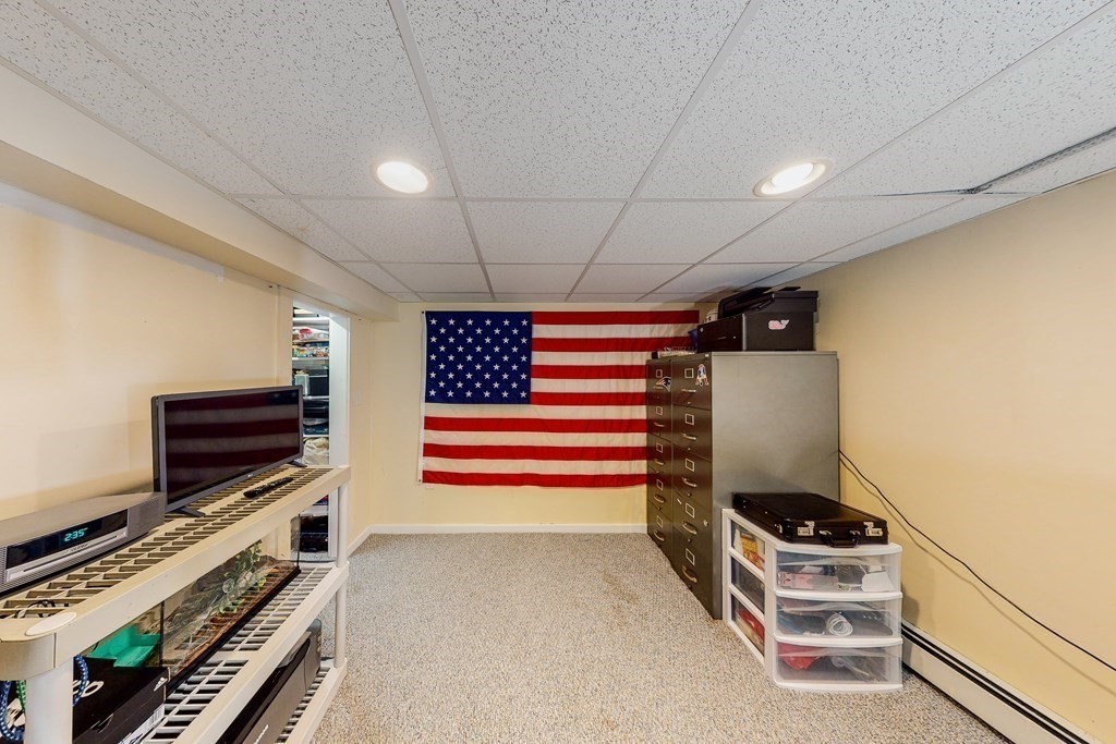 14 Gordon Road Milton, MA 02186 - Photo 30 of 38 a room with furniture and a flat screen tv