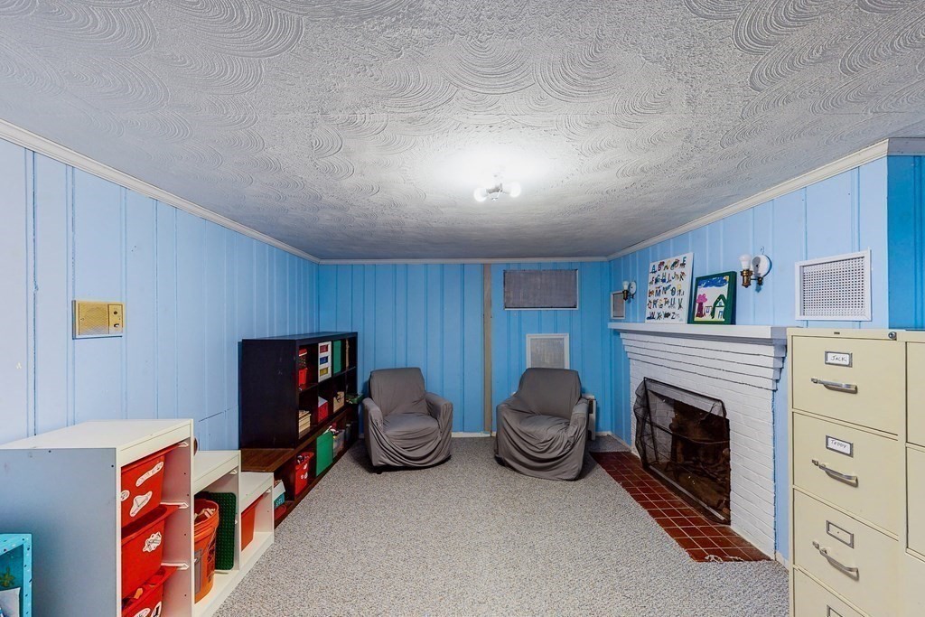 14 Gordon Road Milton, MA 02186 - Photo 32 of 38 a livingroom with furniture and a fireplace