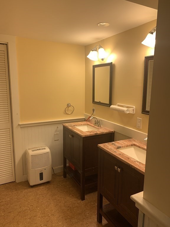 14 Gordon Road Milton, MA 02186 - Photo 34 of 38 a bathroom with a sink and a mirror