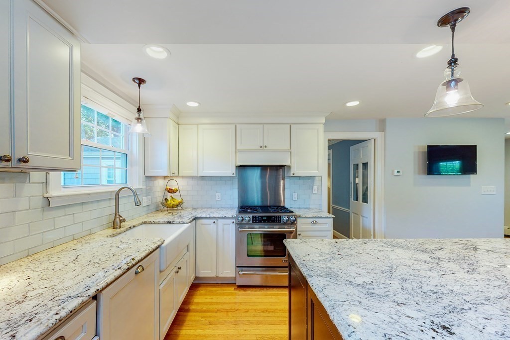 14 Gordon Road Milton, MA 02186 - Photo 5 of 38 a kitchen with stainless steel appliances granite countertop a sink stove and refrigerator