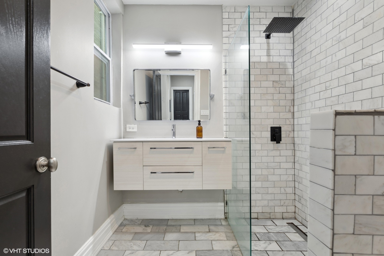 456 West 44th Street, Unit 1 Chicago, IL 60609 - Photo 14 of 19 a bathroom with a sink a toilet and shower