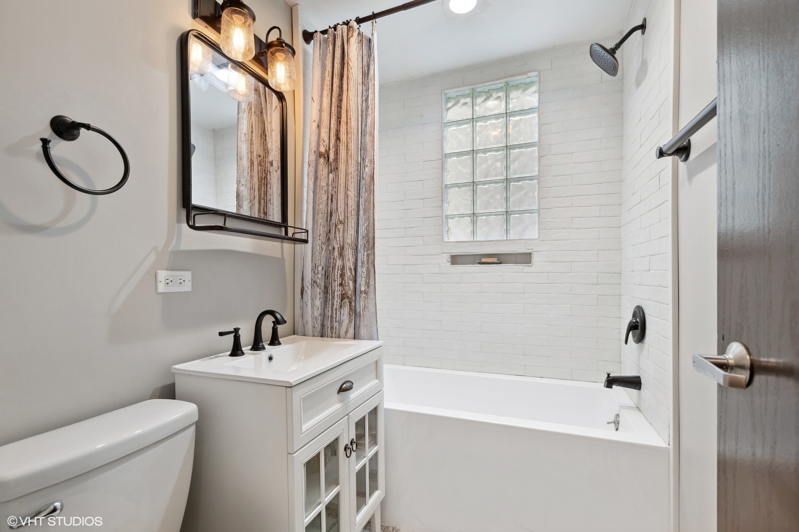 456 West 44th Street, Unit 1 Chicago, IL 60609 - Photo 16 of 19 a bathroom with a sink a toilet and shower