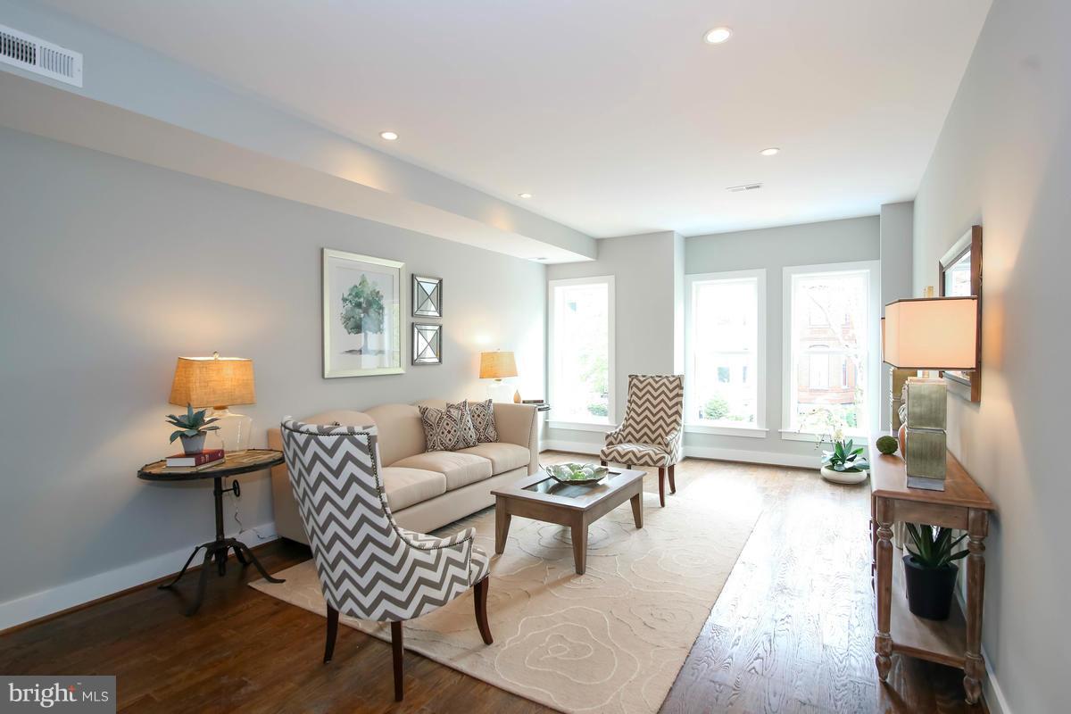 423 7th Street Southeast Washington, DC 20003 - Photo 12 of 29 a living room with furniture and a wooden floor