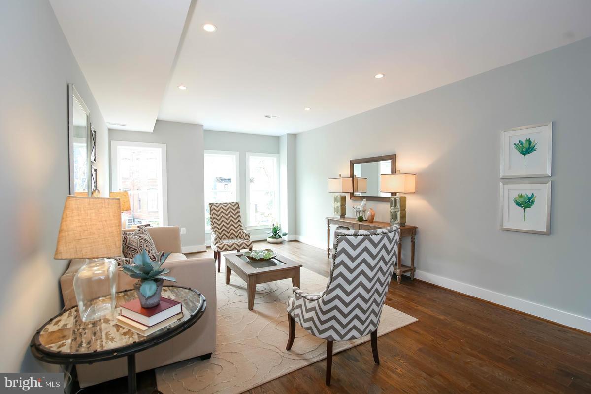 423 7th Street Southeast Washington, DC 20003 - Photo 13 of 29 a living room with furniture and a wooden floor