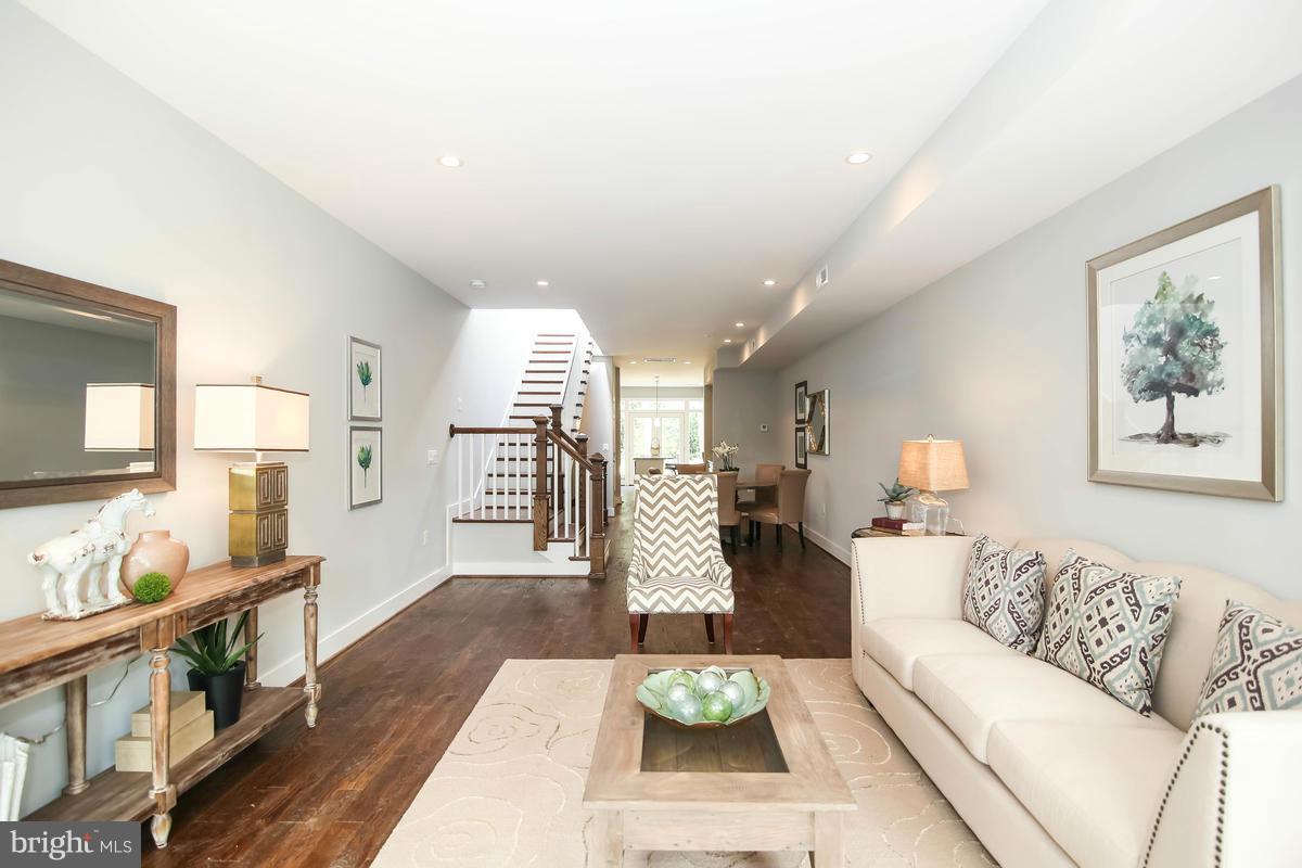 423 7th Street Southeast Washington, DC 20003 - Photo 14 of 29 a living room with furniture and a wooden floor