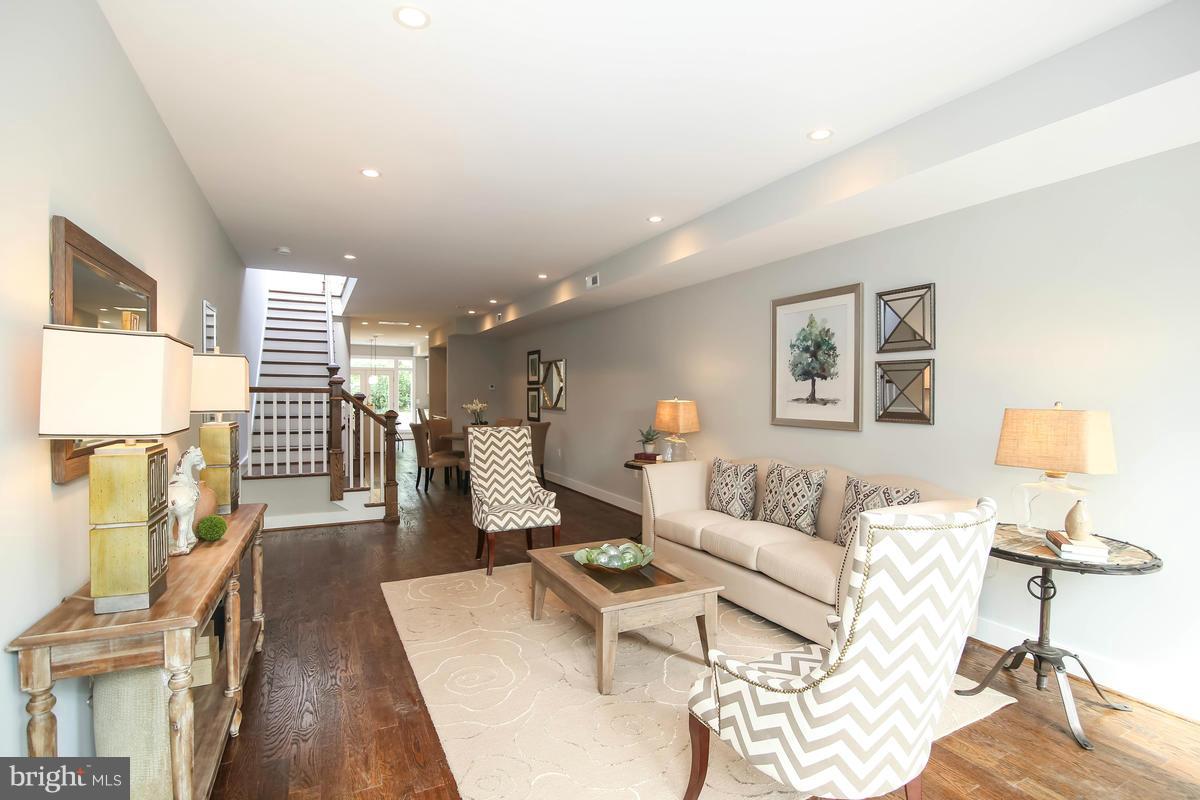 423 7th Street Southeast Washington, DC 20003 - Photo 15 of 29 a living room with furniture and a wooden floor