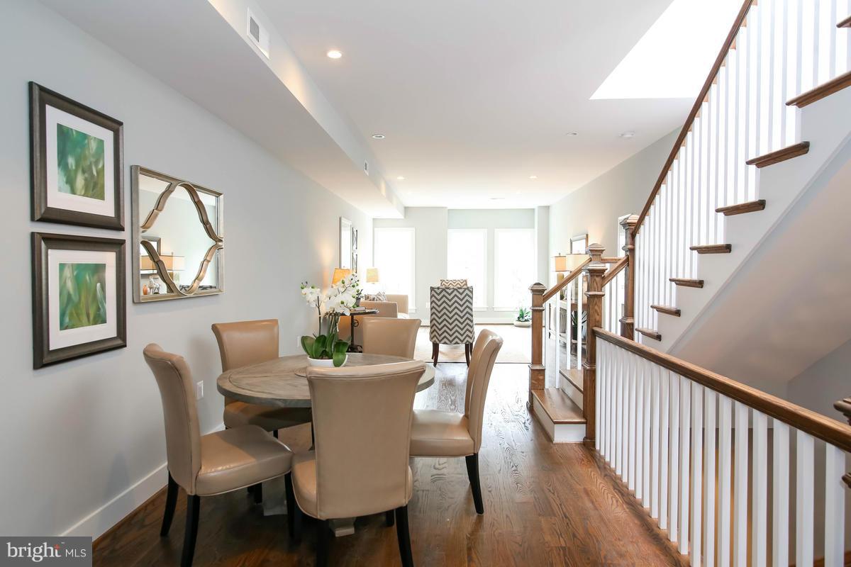 423 7th Street Southeast Washington, DC 20003 - Photo 16 of 29 a view of a dining room with furniture window and wooden floor