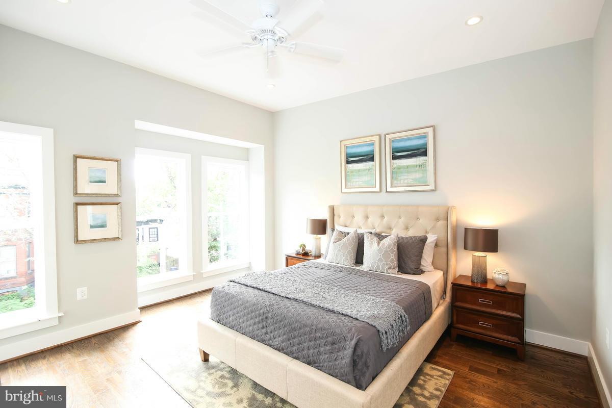 423 7th Street Southeast Washington, DC 20003 - Photo 20 of 29 a bedroom with a large bed and a window