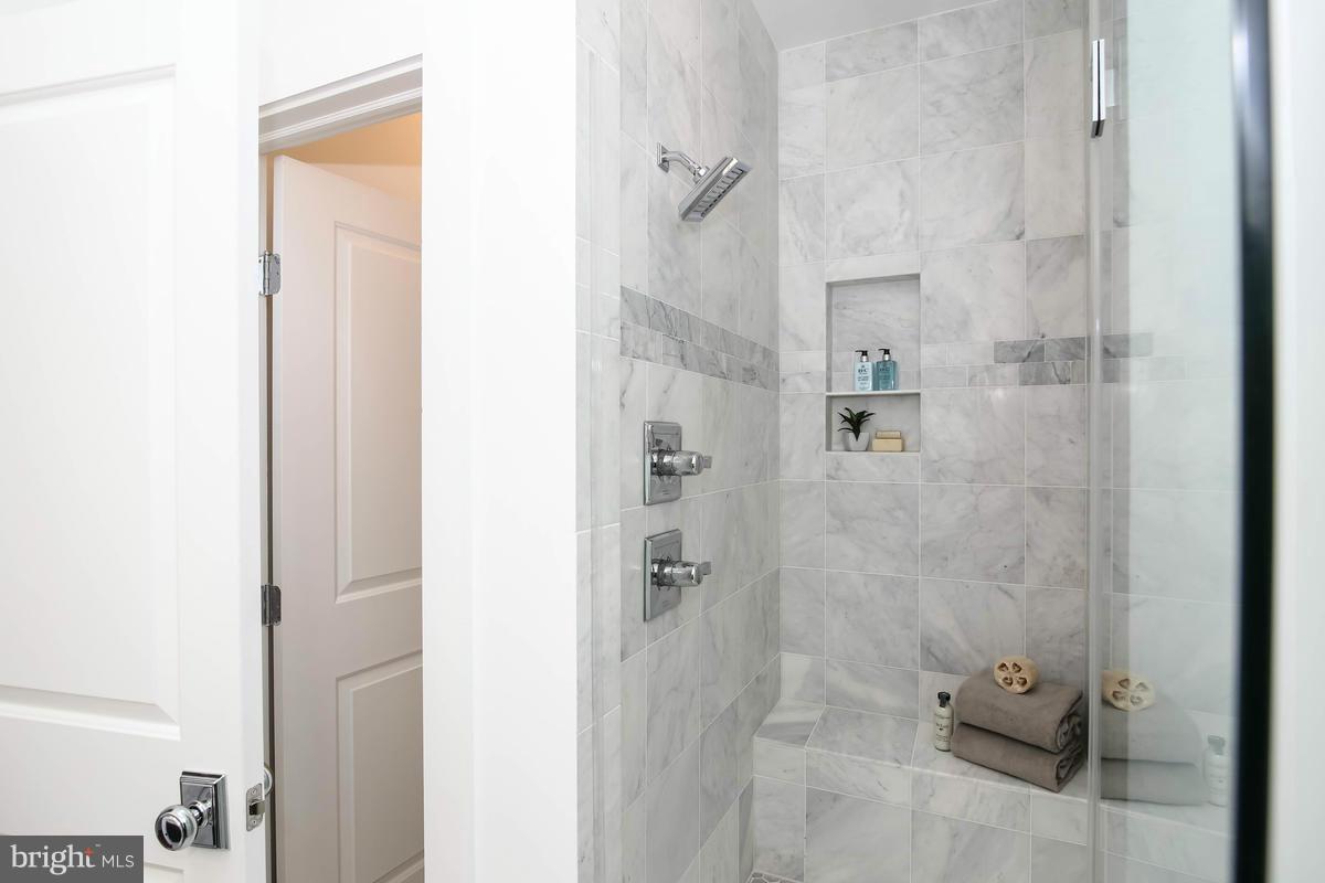423 7th Street Southeast Washington, DC 20003 - Photo 24 of 29 a bathroom with a glass shower door