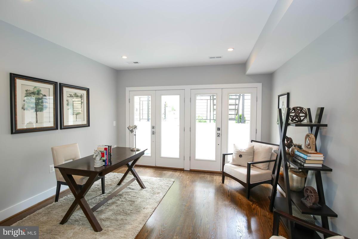 423 7th Street Southeast Washington, DC 20003 - Photo 4 of 29 a living room with furniture and wooden floor