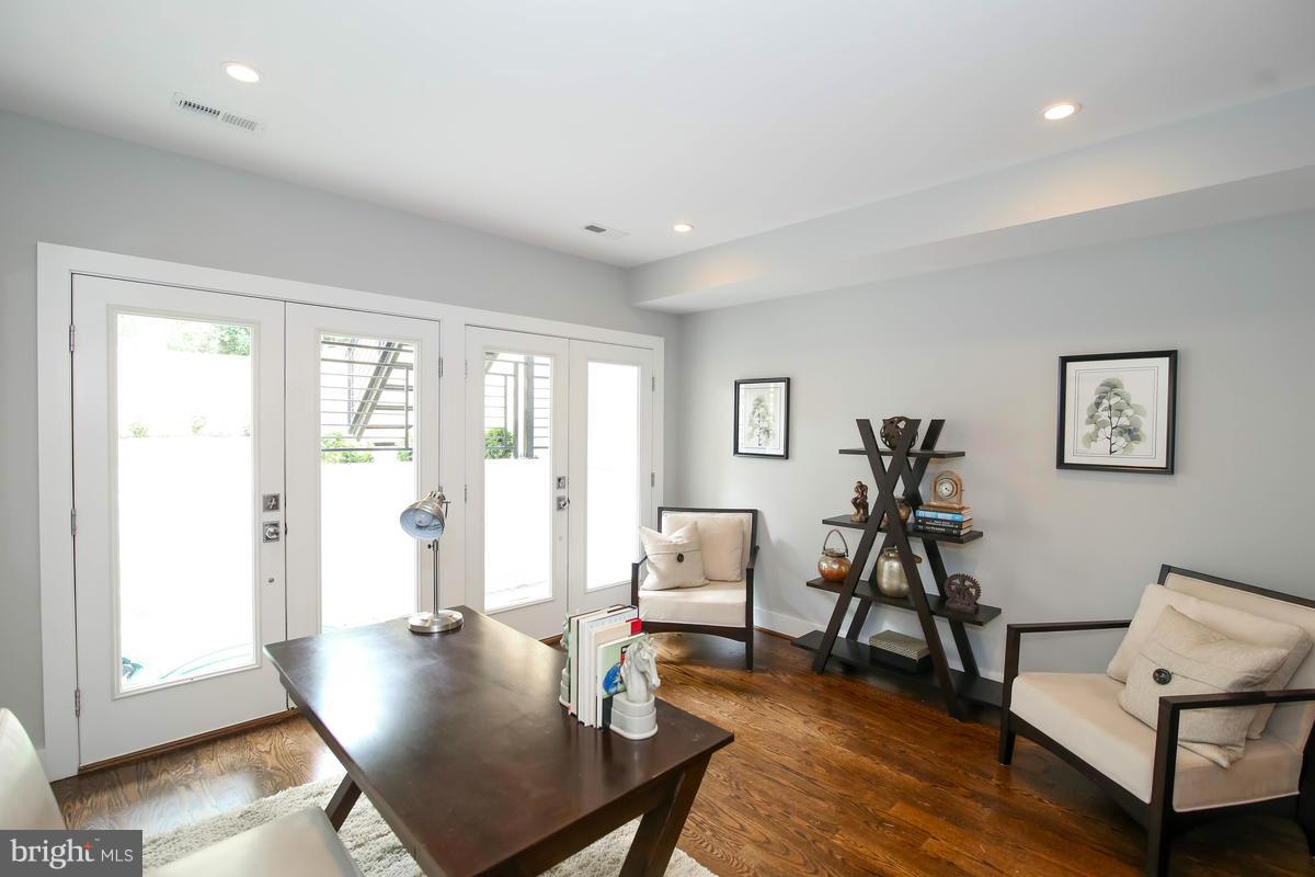 423 7th Street Southeast Washington, DC 20003 - Photo 5 of 29 a living room with furniture and a window