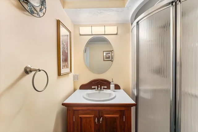 a bathroom with a sink and a mirror