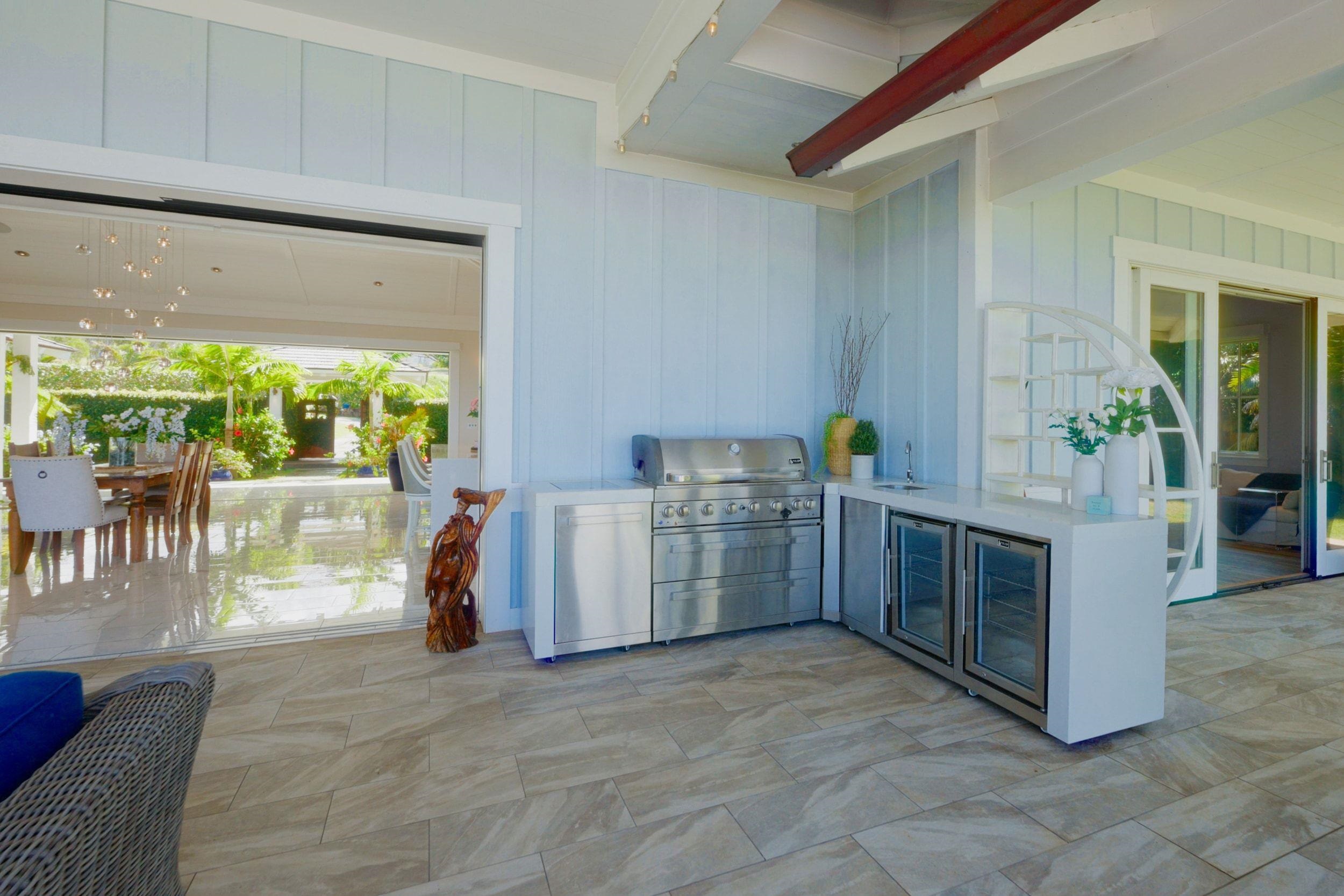 300 Mahana Ridge Street Lahaina, HI 96761 - Photo 15 of 50 a kitchen with a stove and a white cabinets