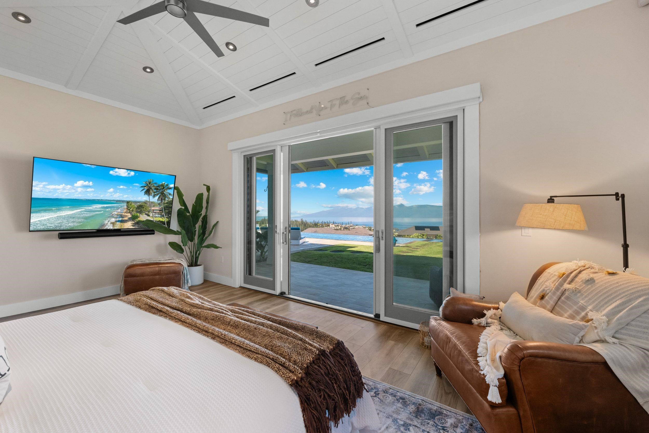 300 Mahana Ridge Street Lahaina, HI 96761 - Photo 20 of 50 a bedroom with a large bed and a flat tv screen on dresser