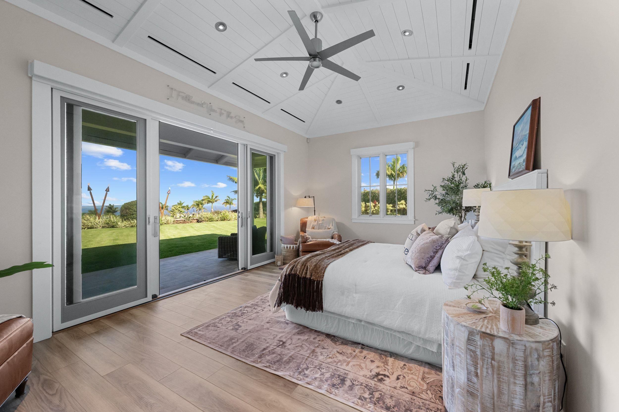300 Mahana Ridge Street Lahaina, HI 96761 - Photo 22 of 50 a bedroom with a bed and a glass top table