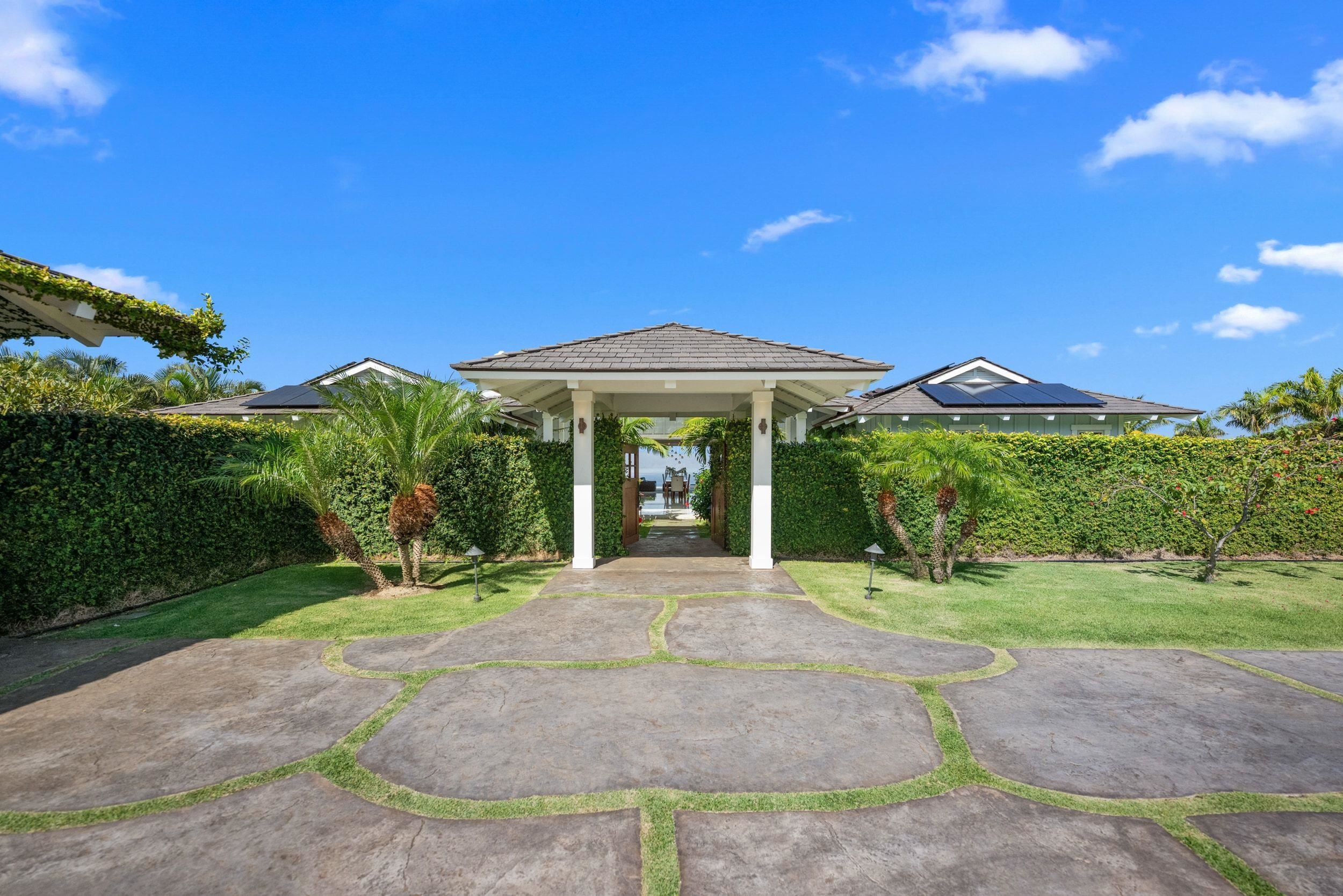 300 Mahana Ridge Street Lahaina, HI 96761 - Photo 3 of 50 a front view of a house with garden