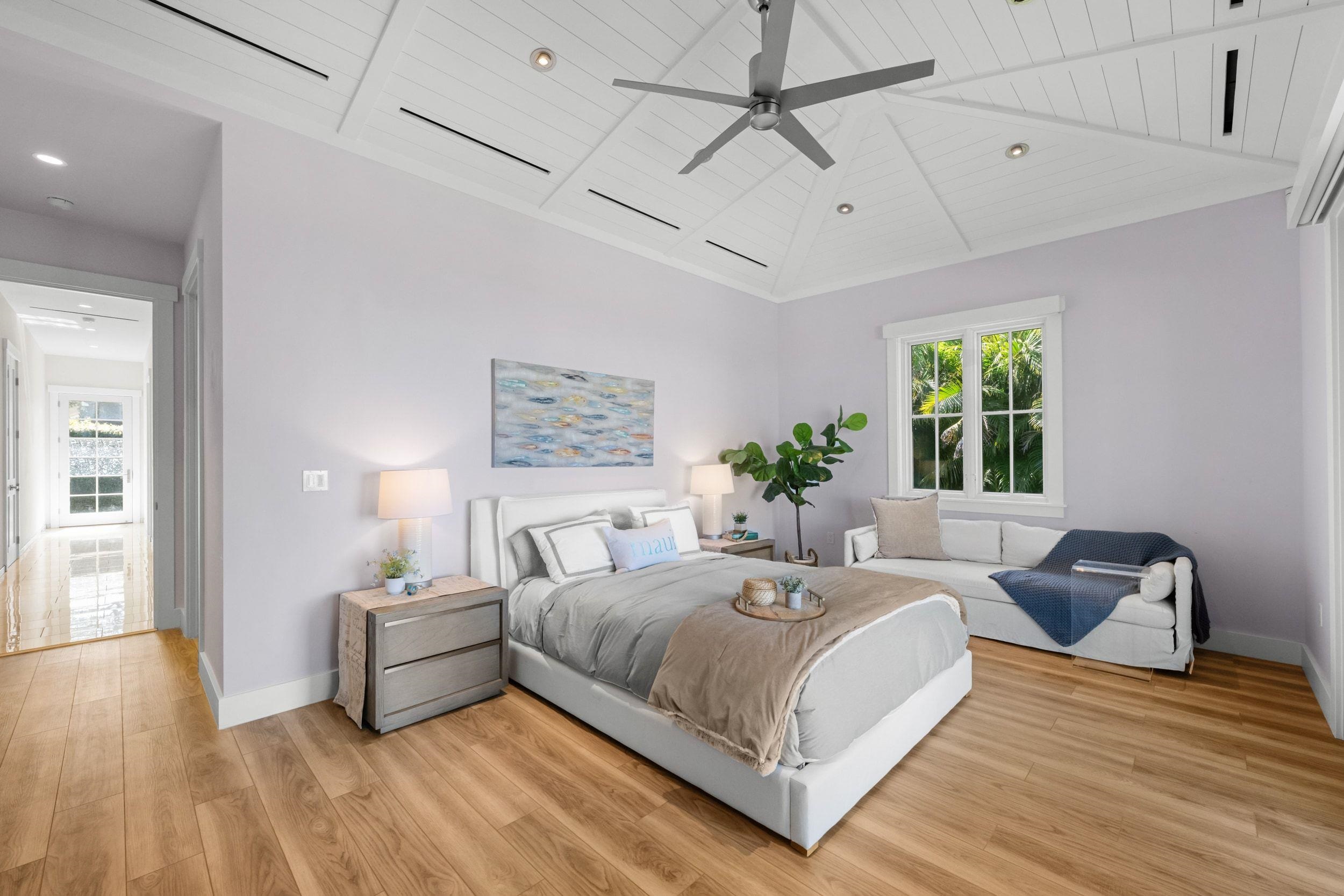 300 Mahana Ridge Street Lahaina, HI 96761 - Photo 33 of 50 a bedroom with a large bed and a couch