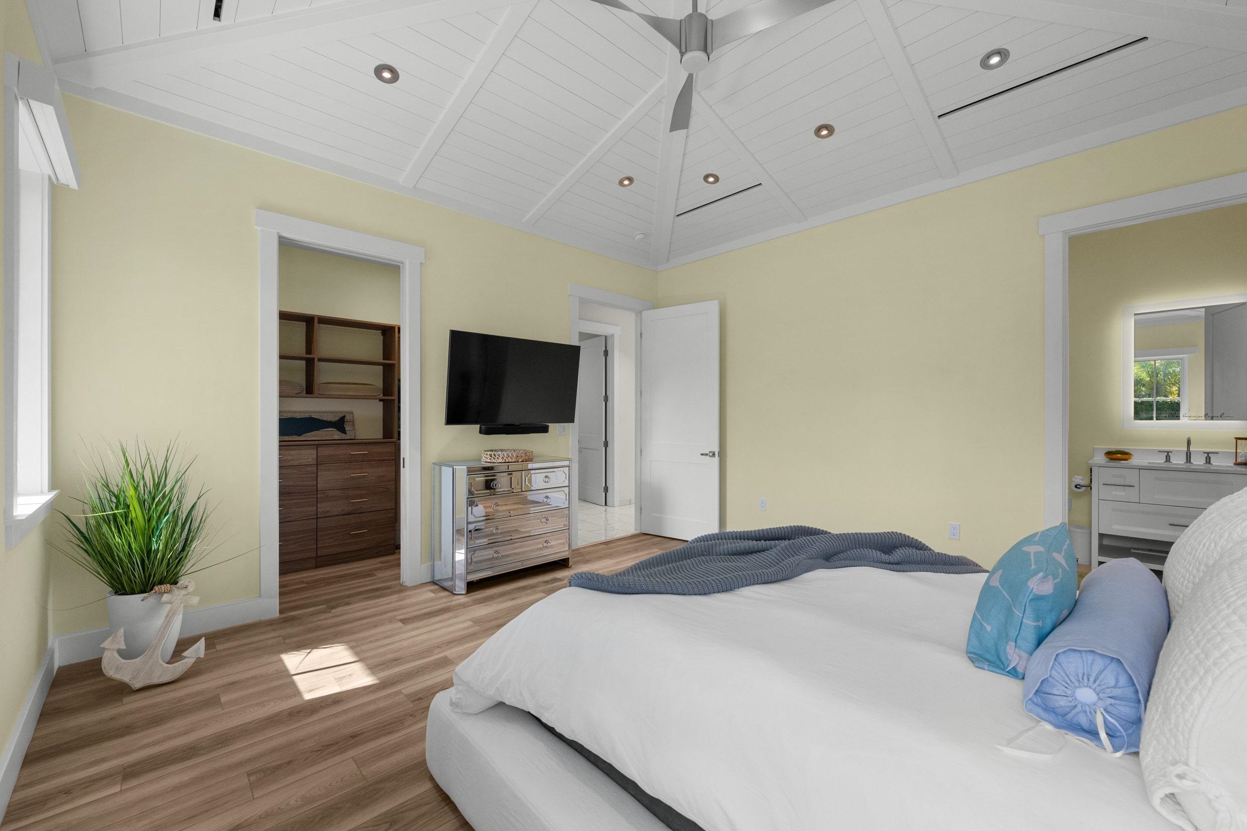 300 Mahana Ridge Street Lahaina, HI 96761 - Photo 40 of 50 a bedroom with a bed and flat screen tv