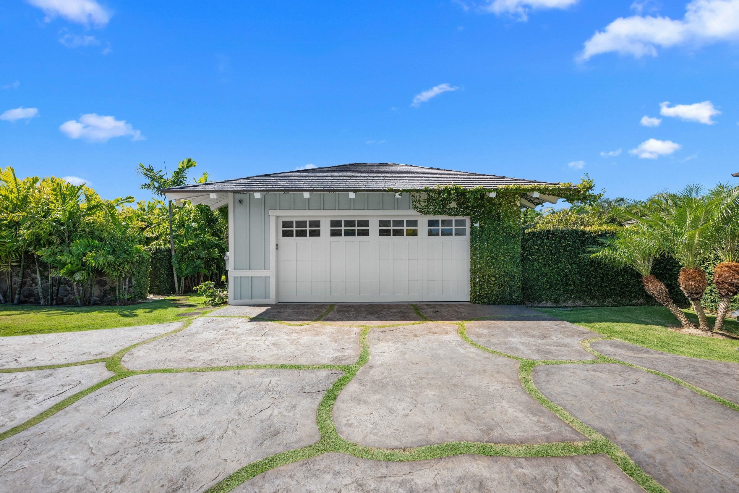 300 Mahana Ridge Street Lahaina, HI 96761 - Photo 47 of 50 a view of a house with a yard and a large tree