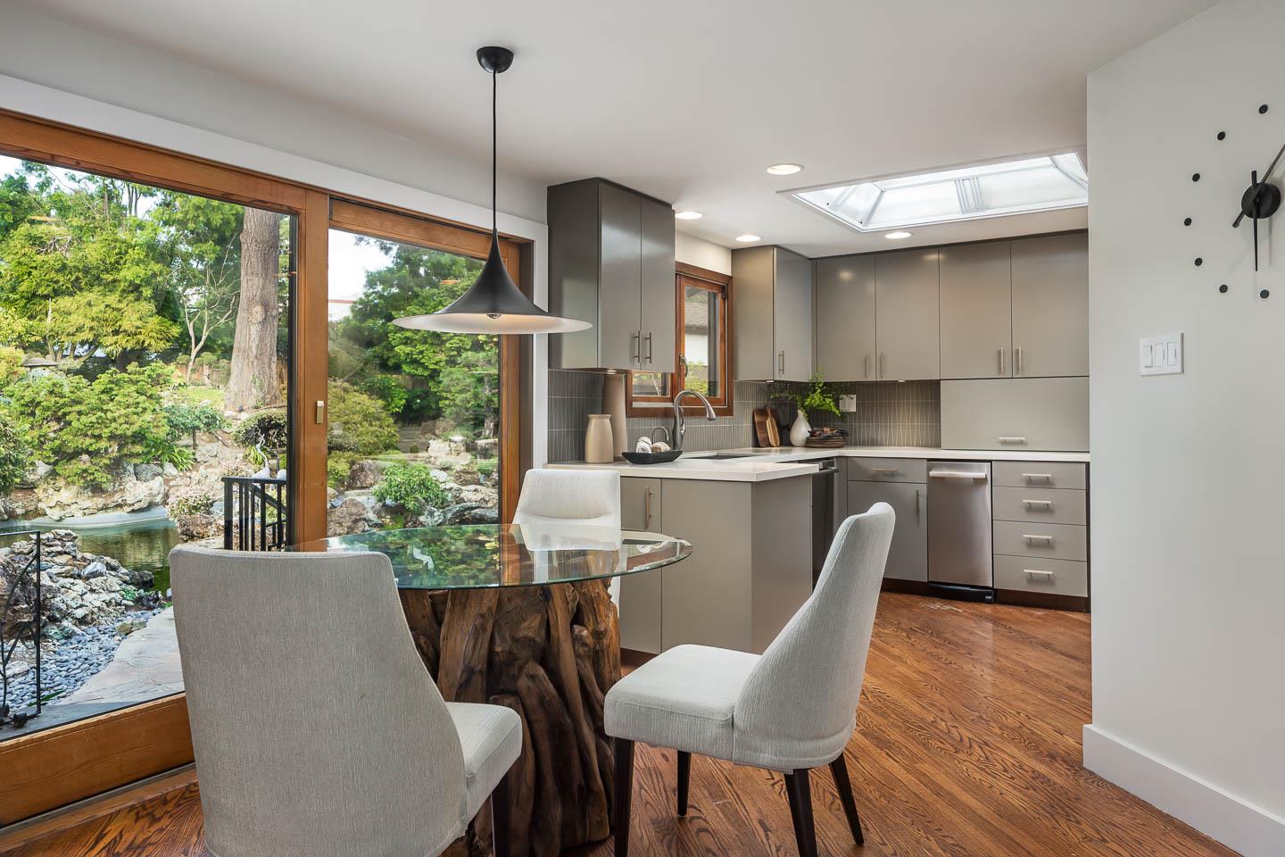 70 De Sabla Road San Mateo, CA 94402 - Photo 13 of 17 a dining room with furniture a window and wooden floor