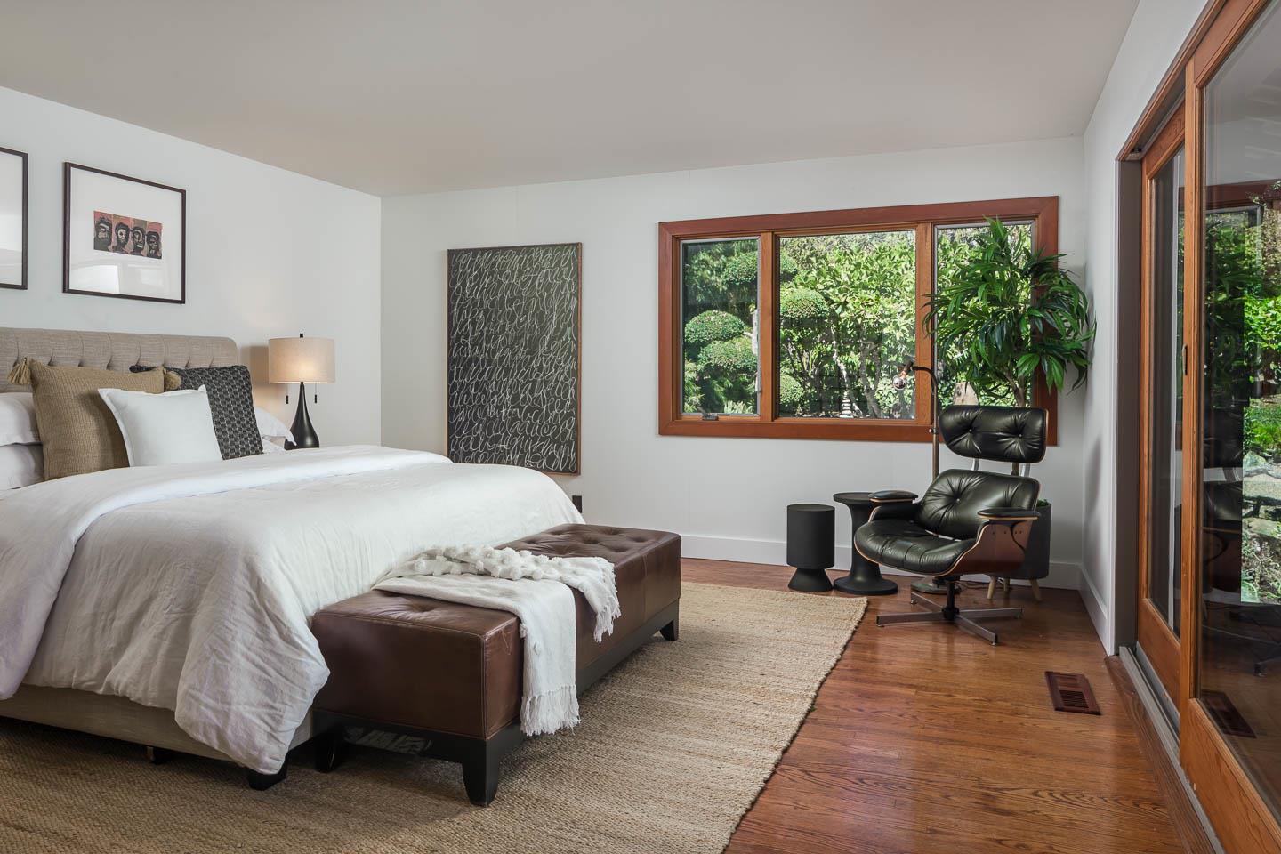 70 De Sabla Road San Mateo, CA 94402 - Photo 4 of 17 a bedroom with a bed and large windows