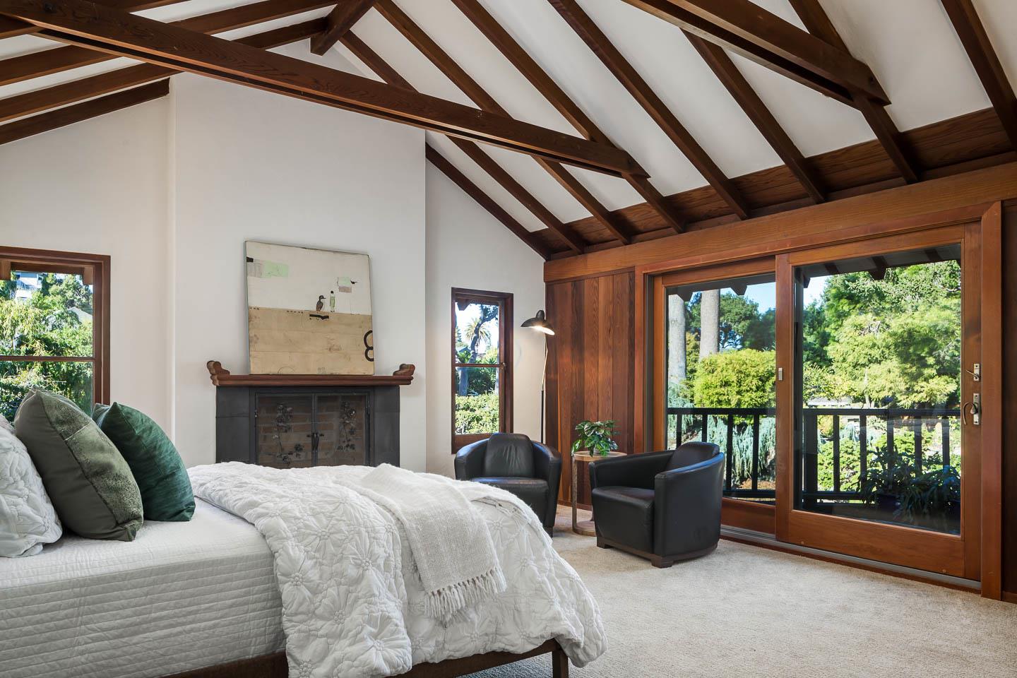 70 De Sabla Road San Mateo, CA 94402 - Photo 6 of 17 a spacious bedroom with a large bed and a large window