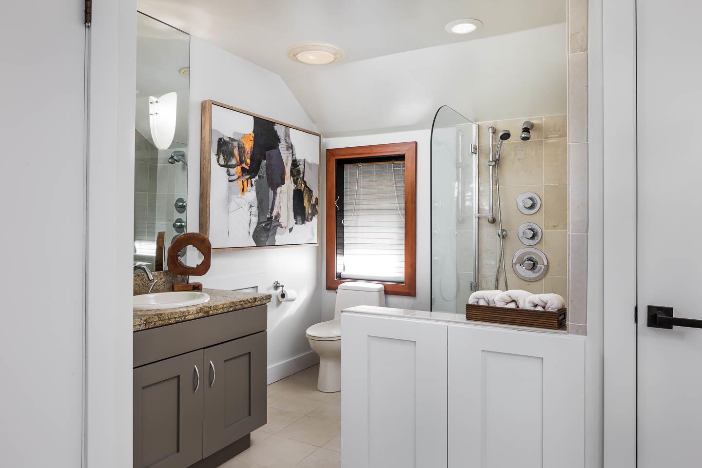 70 De Sabla Road San Mateo, CA 94402 - Photo 7 of 17 a bathroom with a sink a toilet and a mirror