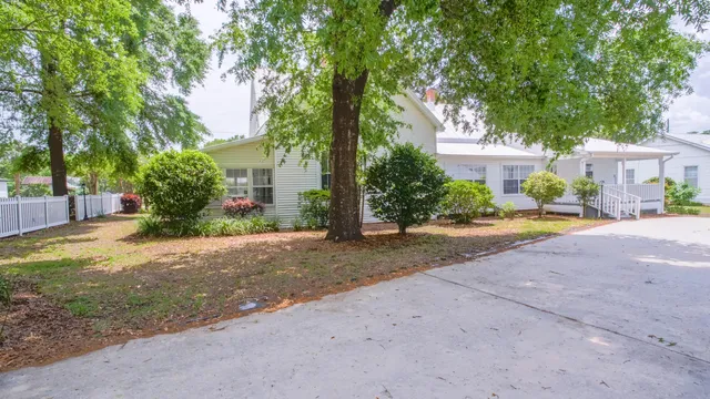 a view of backyard of house with garage