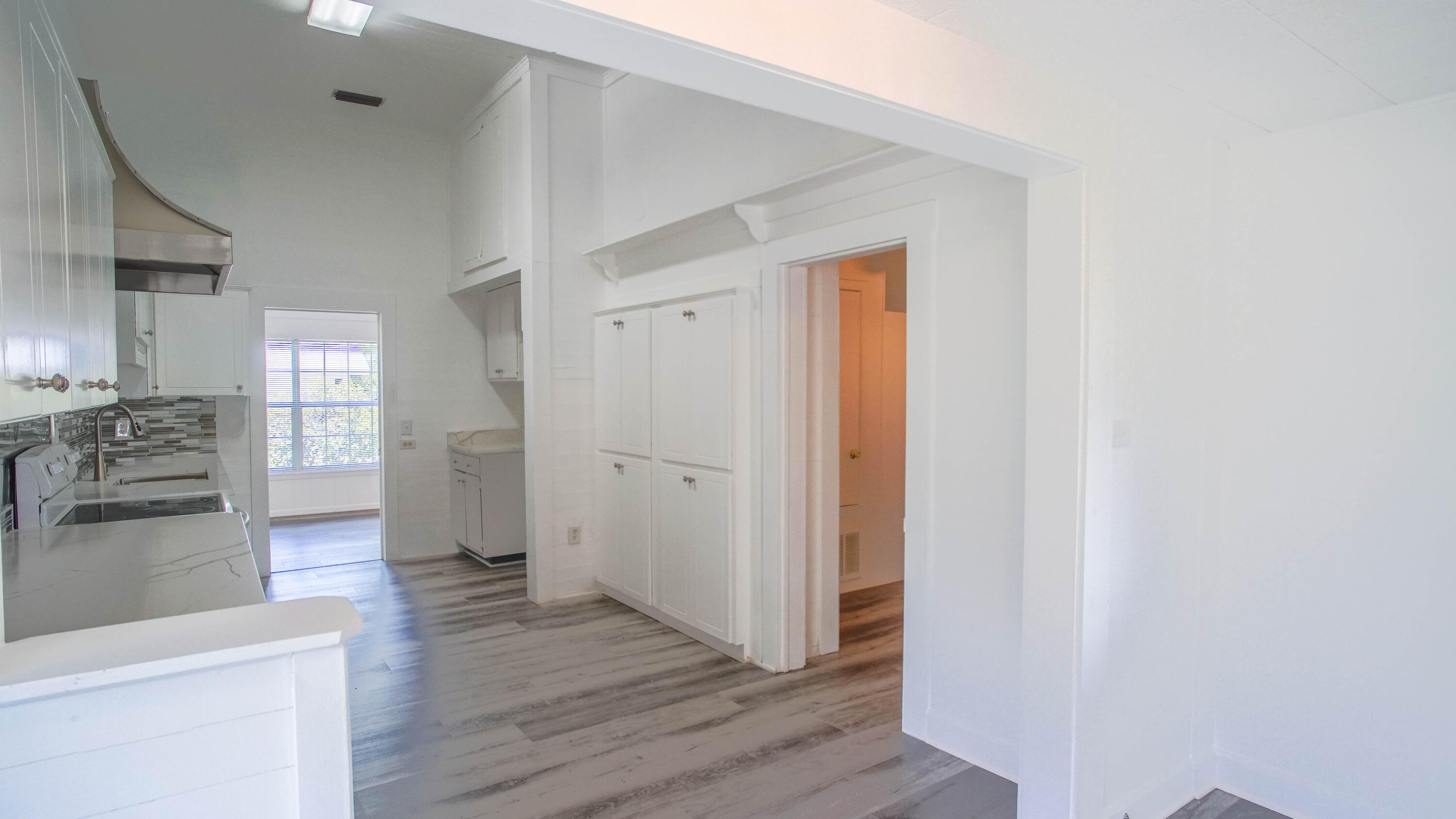 270 South 12th Street DeFuniak Springs, FL 32435 - Photo 16 of 57 a view of a kitchen cabinets and wooden floor