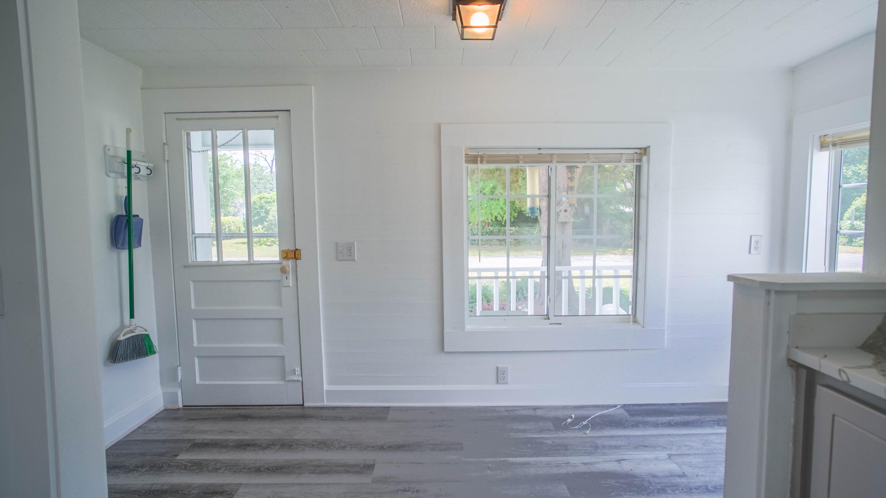 270 South 12th Street DeFuniak Springs, FL 32435 - Photo 17 of 57 a view of an empty room with wooden floor and a window