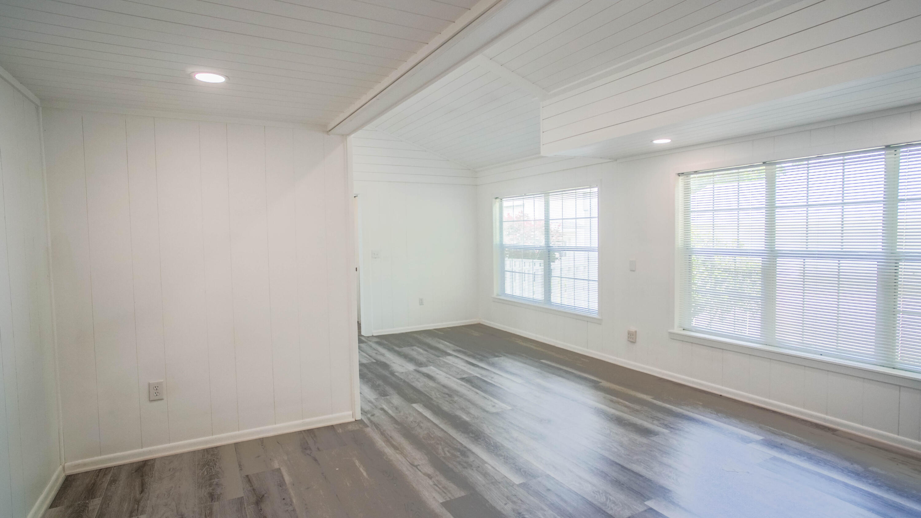 270 South 12th Street DeFuniak Springs, FL 32435 - Photo 19 of 57 an empty room with wooden floor and windows