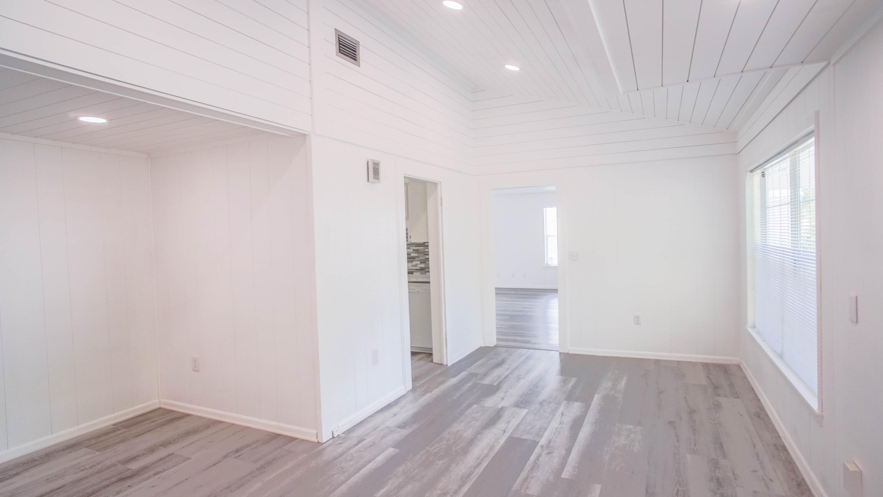 270 South 12th Street DeFuniak Springs, FL 32435 - Photo 21 of 57 a view of empty room with wooden floor and window