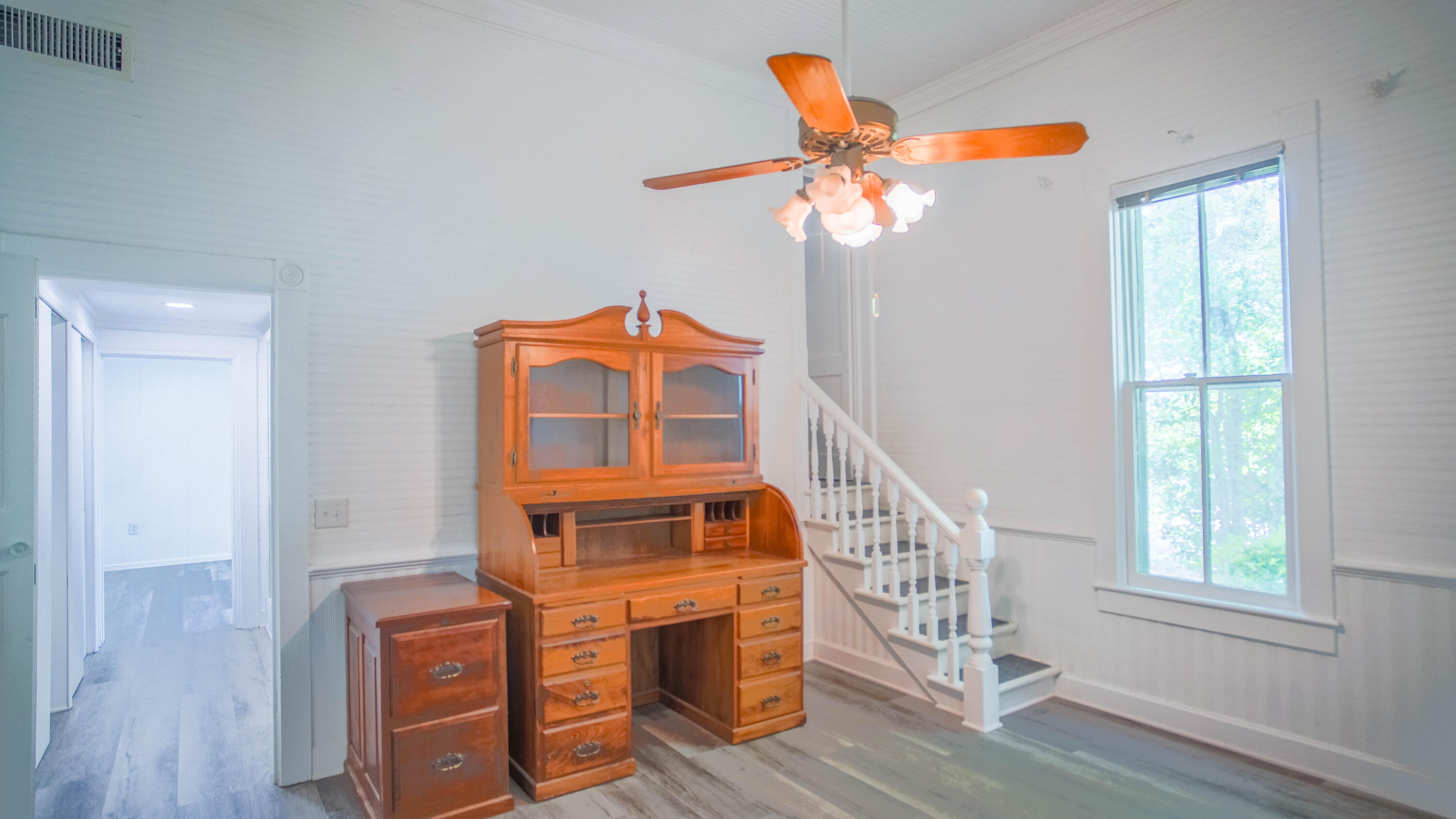 270 South 12th Street DeFuniak Springs, FL 32435 - Photo 22 of 57 a view of a livingroom with a ceiling fan and window