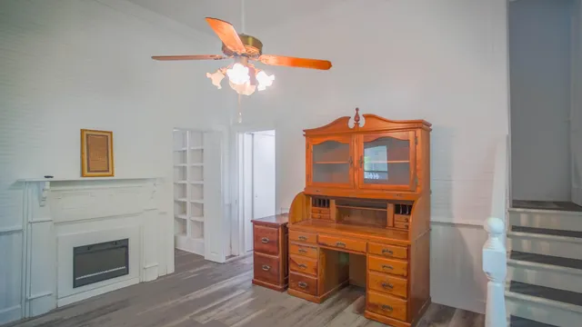 a view of an entryway with wooden floor