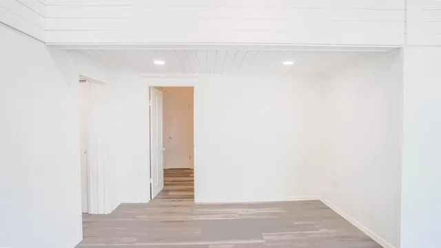 a bathroom with a sink mirror vanity and toilet