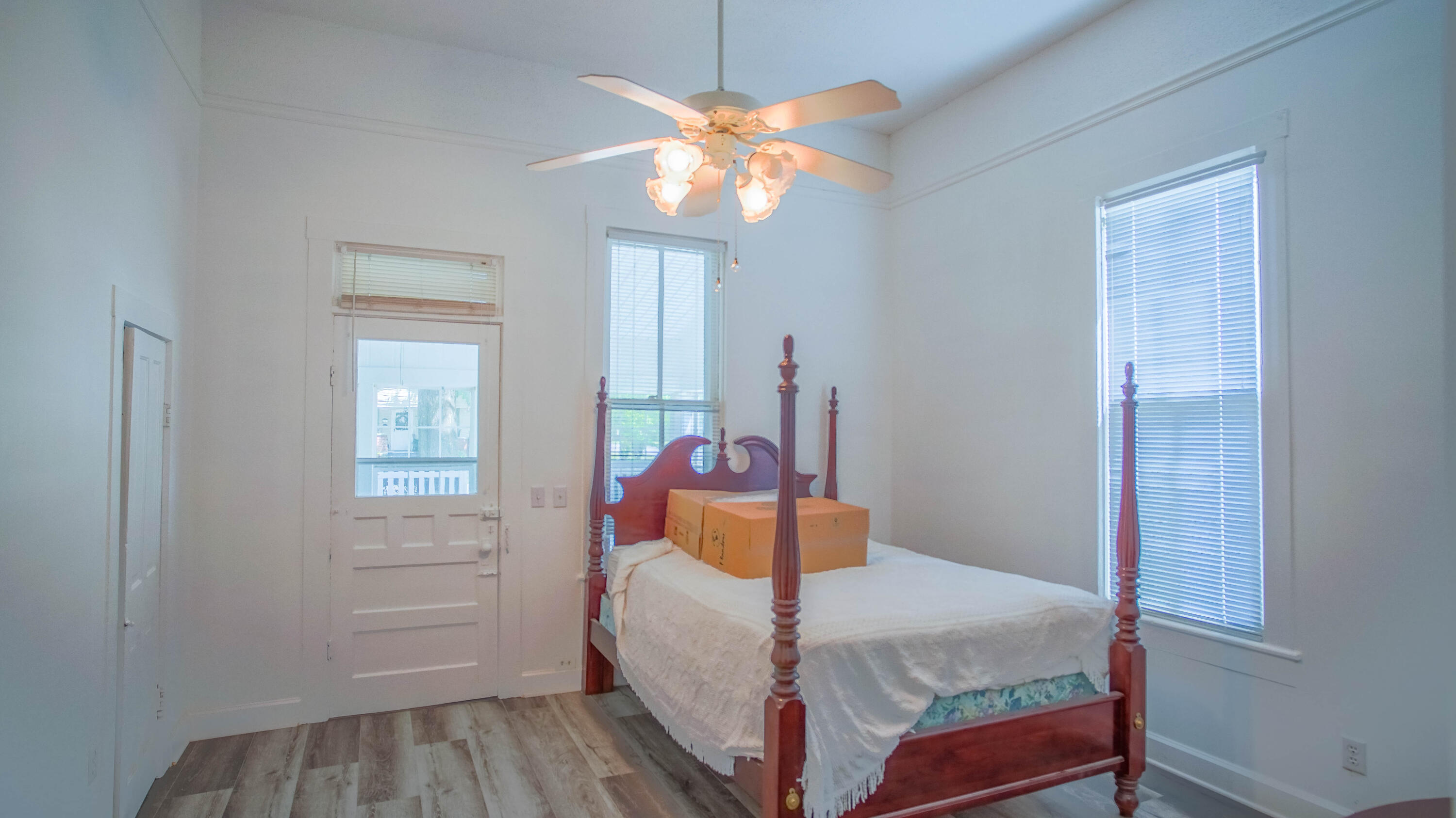 270 South 12th Street DeFuniak Springs, FL 32435 - Photo 29 of 57 a bedroom with a bed and a chandelier